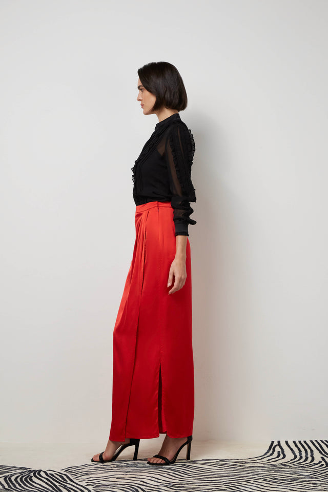 Side profile of a woman wearing a red 'Torch song' skirt