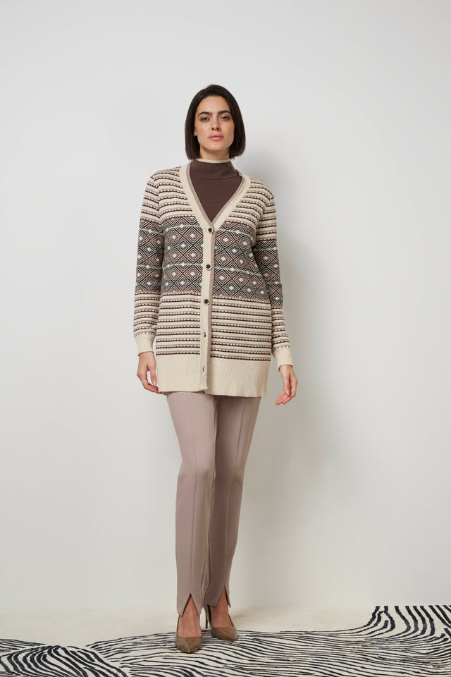 Front profile of a woman wearing a brown 'Glinka' sweater coat