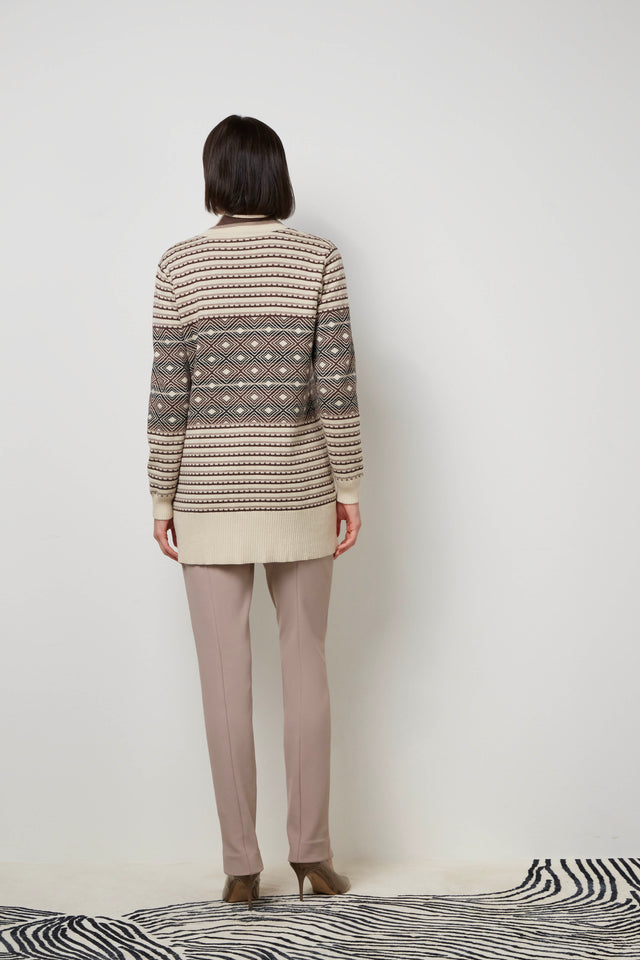 Back of a woman wearing a brown 'Glinka' sweater coat