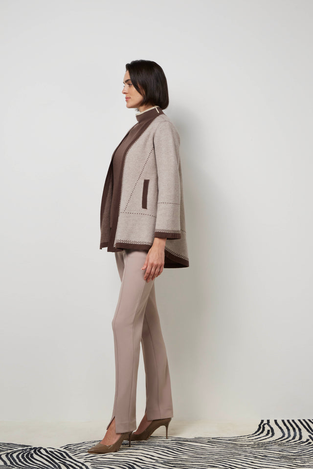 Side profile of a woman wearing a mocha 'Elite' cardigan