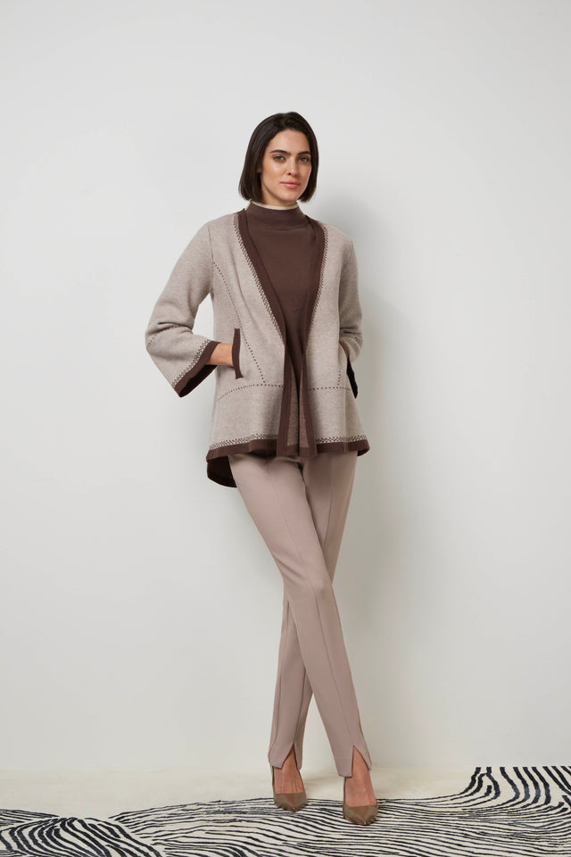 Front profile of a woman wearing a mocha 'Elite' cardigan