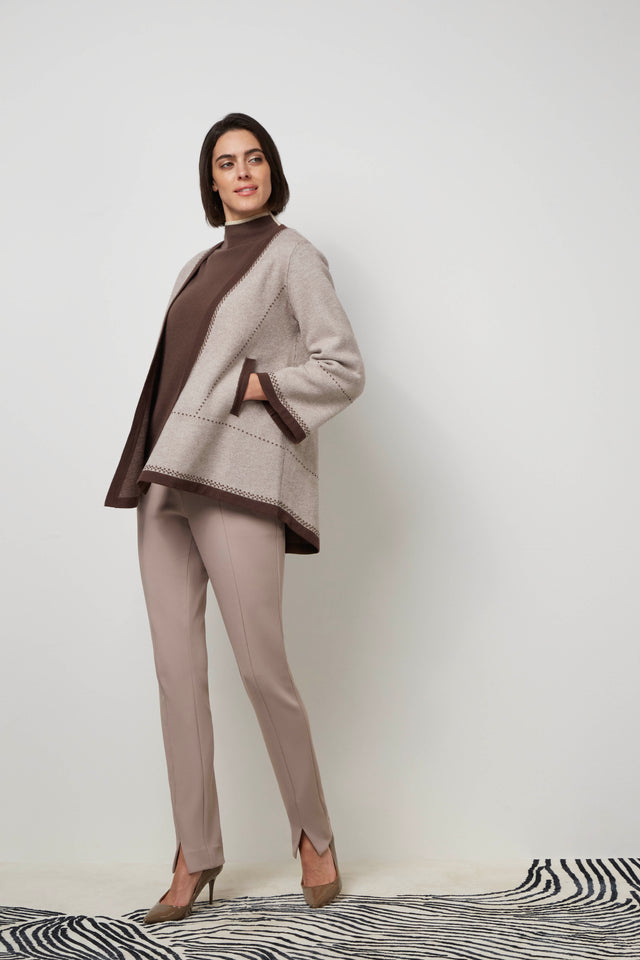 Side profile of a woman wearing a mocha 'Elite' cardigan