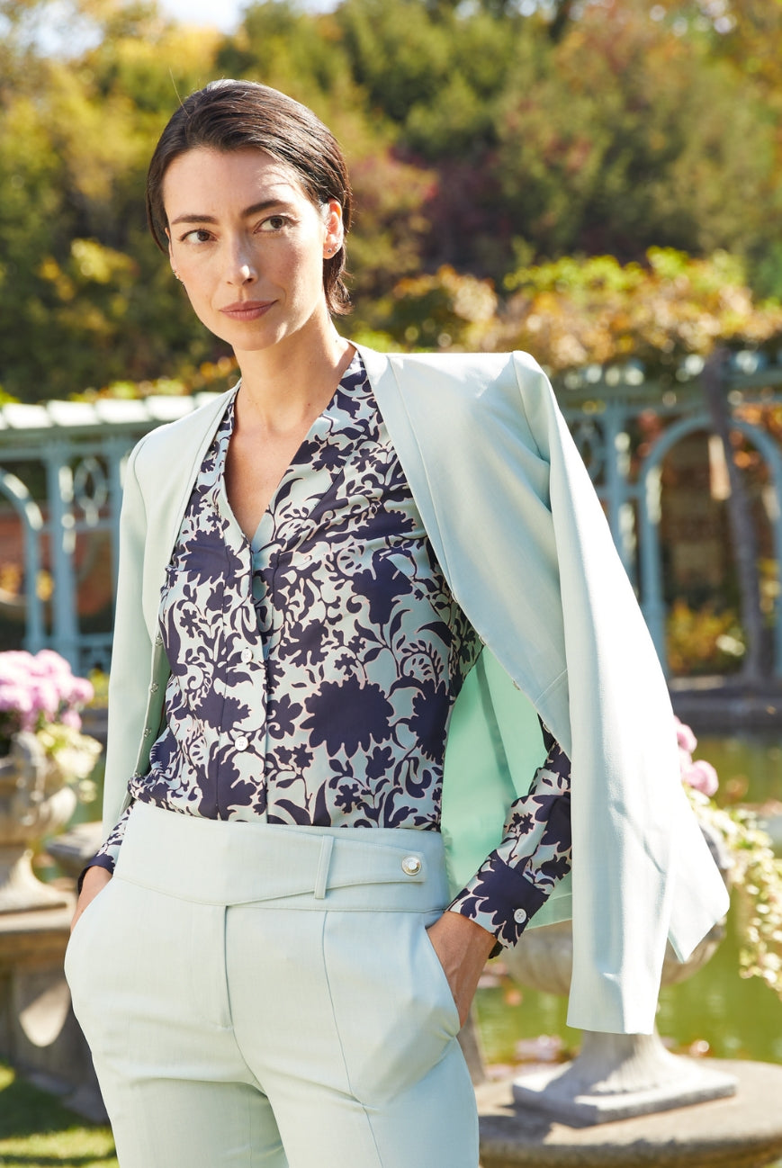 Shop The Season's Most Coveted Styles - Model is wearing Waterside Jacket, Atrium Blouse, and Inlet Pants.